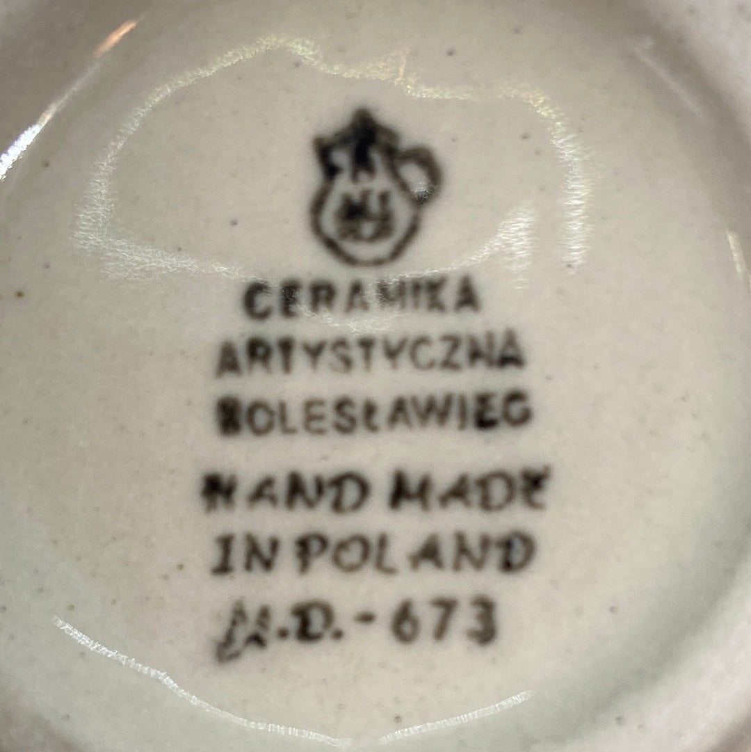 Bottom base of a Ceramika Artystyczna Polish pottery bubble mug, showing the official factory stamp and unglazed foot ring.