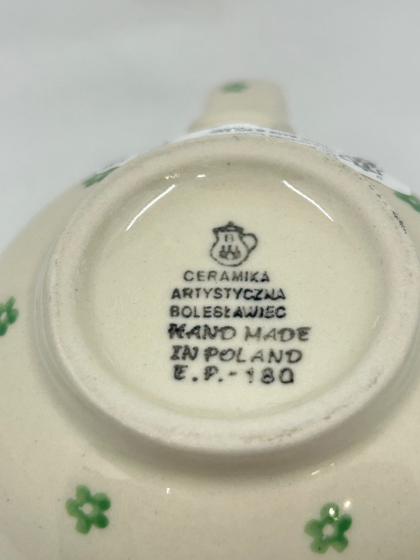 Bottom base of a Ceramika Artystyczna Polish pottery bubble mug showing the official factory logo and Hand Made in Poland stamp.