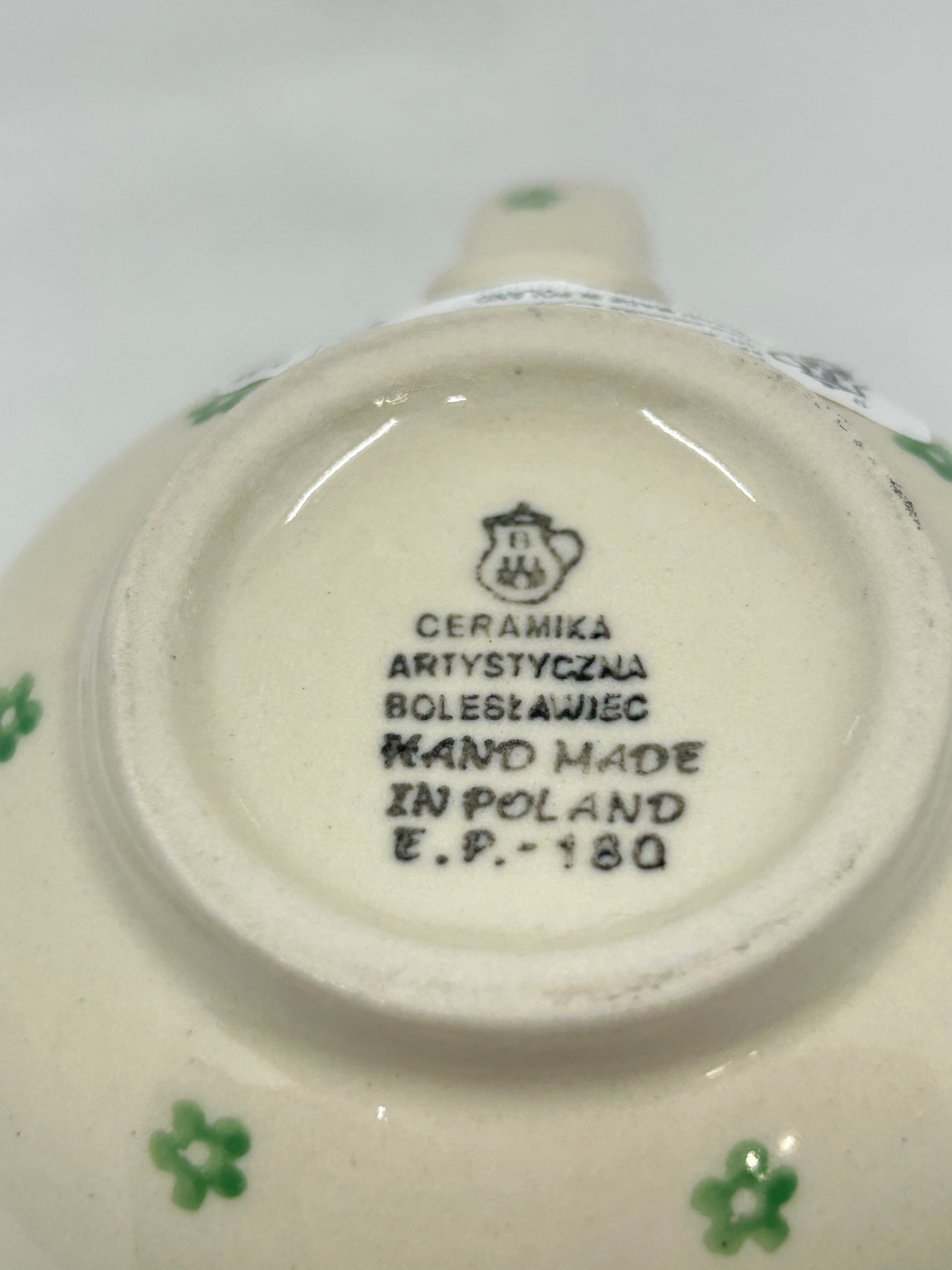 Bottom base of a Ceramika Artystyczna Polish pottery bubble mug showing the official factory logo and Hand Made in Poland stamp.