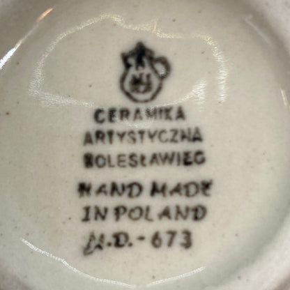 Bottom base of a Ceramika Artystyczna Polish pottery bubble mug, showing the official factory stamp and unglazed foot ring.